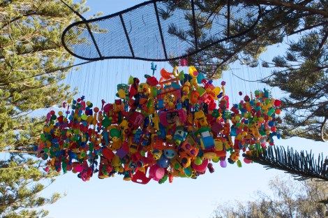 Big sculpture made of little kids toys. Child's play really.